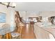 Open concept dining area with glass table and hardwood floors at 943 Ocean Blvd., Holden Beach, NC 28462