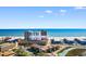 Aerial view of condo complex near ocean, highlighting its coastal setting at 9501 Shore Dr. # D-235, Myrtle Beach, SC 29572