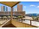 Balcony view of parking lot, buildings, and partial ocean view at 9501 Shore Dr. # D-235, Myrtle Beach, SC 29572