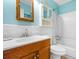 Clean bathroom with a blue vanity, shower, and white toilet at 9501 Shore Dr. # D-235, Myrtle Beach, SC 29572