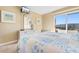 King bed in sunny bedroom with balcony access and dresser at 9501 Shore Dr. # D-235, Myrtle Beach, SC 29572