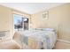 King-size bed in a bedroom with sliding doors leading to a balcony at 9501 Shore Dr. # D-235, Myrtle Beach, SC 29572