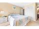 King-size bed in a well-lit bedroom with double doors to closet at 9501 Shore Dr. # D-235, Myrtle Beach, SC 29572