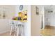 Small breakfast bar with two chairs, view of kitchen at 9501 Shore Dr. # D-235, Myrtle Beach, SC 29572