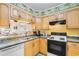 Condo kitchen with double sink and pass-through window at 9501 Shore Dr. # D-235, Myrtle Beach, SC 29572