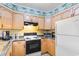 Condo kitchen with stove, oven, microwave, and dishwasher at 9501 Shore Dr. # D-235, Myrtle Beach, SC 29572