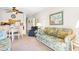 Spacious living room with sofa and access to dining area at 9501 Shore Dr. # D-235, Myrtle Beach, SC 29572