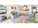 Living room with couches and TV, adjacent to dining area at 9501 Shore Dr. # D-235, Myrtle Beach, SC 29572
