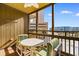 Screened balcony with outdoor seating and ocean view at 9501 Shore Dr. # D-235, Myrtle Beach, SC 29572