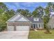 House exterior featuring a 3-car garage, brick and siding at Lot 729 Zoe Way, Myrtle Beach, SC 29588