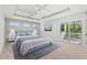 Spacious bedroom with a blue bed, ceiling fan and access to a balcony at Tbd Mud Minnow Dr., Pawleys Island, SC 29585