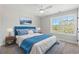 Bright bedroom with a blue upholstered bed and large window at Tbd Mud Minnow Dr., Pawleys Island, SC 29585