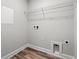Bright laundry room with built-in shelving and vinyl flooring at Tbd Mud Minnow Dr., Pawleys Island, SC 29585