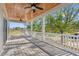 Relaxing porch with wooden ceiling, white railings, and treetop views at Tbd Mud Minnow Dr., Pawleys Island, SC 29585