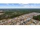 Aerial view of neighborhood showcasing homes and landscape at 130 Tomoka Trail, Longs, SC 29568