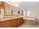 Bathroom with double vanity, garden tub, and shower at 130 Tomoka Trail, Longs, SC 29568