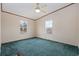 Bedroom with green carpet and two windows at 130 Tomoka Trail, Longs, SC 29568