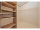 Walk-in closet with wood shelving and hanging rods at 130 Tomoka Trail, Longs, SC 29568