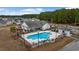Community pool with surrounding patio and seating at 130 Tomoka Trail, Longs, SC 29568