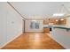 Bright dining room with wood flooring and access to kitchen at 130 Tomoka Trail, Longs, SC 29568