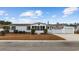 Single-wide manufactured home with attached garage and screened porch at 130 Tomoka Trail, Longs, SC 29568
