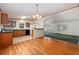 Kitchen with wood cabinets, tiled floor, and breakfast bar at 130 Tomoka Trail, Longs, SC 29568