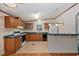 Efficient kitchen with wood cabinets and appliances at 130 Tomoka Trail, Longs, SC 29568