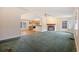 Spacious living room with fireplace and view into the kitchen at 130 Tomoka Trail, Longs, SC 29568
