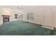 Living room featuring a fireplace and green carpeting at 130 Tomoka Trail, Longs, SC 29568