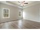 Spacious bedroom with wood-look floors and ceiling fan at 1308 Crooked Hook Rd., North Myrtle Beach, SC 29582