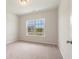 Well-lit bedroom with large window and carpet at 1308 Crooked Hook Rd., North Myrtle Beach, SC 29582