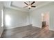 Bright bedroom with wood-look floors and access to bathroom at 1308 Crooked Hook Rd., North Myrtle Beach, SC 29582