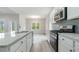 Bright kitchen featuring granite countertops and stainless steel appliances at 1308 Crooked Hook Rd., North Myrtle Beach, SC 29582