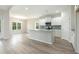 Modern kitchen with island and white cabinets at 1308 Crooked Hook Rd., North Myrtle Beach, SC 29582