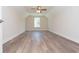 Spacious bedroom with a large window and wood-look flooring at 132 Highwood Circle, Murrells Inlet, SC 29576