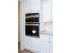 Built-in wall oven and microwave in a white kitchen at 132 Highwood Circle, Murrells Inlet, SC 29576