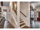 Elegant staircase with dark wood treads and white risers at 15 Melbourne Ct., Murrells Inlet, SC 29576