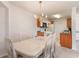 Dining area with kitchen view and chandelier at 2278 Clearwater Dr. # D, Surfside Beach, SC 29575