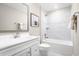Clean bathroom with white vanity, bathtub, and tiled walls at 2341 Elowen Ln. # 11E, Longs, SC 29568