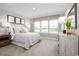 Bright bedroom with large windows, comfortable bed, and stylish decor at 2341 Elowen Ln. # 11E, Longs, SC 29568