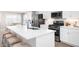 Modern kitchen with white cabinets, stainless steel appliances, and an island at 2341 Elowen Ln. # 11E, Longs, SC 29568