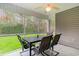 Relaxing screened porch with table and chairs, overlooking backyard at 2432 Summerhaven Loop, Conway, SC 29527