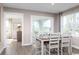 Bright dining room with sliding glass doors leading to backyard at 285 Bent Green Ct. # 76D, Murrells Inlet, SC 29576