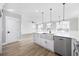 Bright kitchen featuring a farmhouse sink and stainless steel dishwasher at 3368 Gurley Rd., Loris, SC 29569