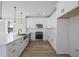 Modern kitchen with white cabinets and quartz countertops at 3368 Gurley Rd., Loris, SC 29569