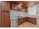 Modern kitchen with stainless steel appliances and wood cabinets at 447 Bragdon Ave., Georgetown, SC 29440