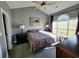 Large bedroom with a king bed and an arched window with blinds at 4717 Wild Iris Dr. # 29-303, Myrtle Beach, SC 29577