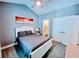 Bright bedroom featuring a comfortable bed and ensuite bathroom at 4717 Wild Iris Dr. # 29-303, Myrtle Beach, SC 29577
