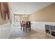 Bright dining room featuring a table with four chairs and decorative wall art at 4809 Pine Lake Dr., Myrtle Beach, SC 29577