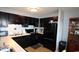 Fully equipped kitchen with dark cabinets and appliances at 5905 S Kings Highway # 545-B, Myrtle Beach, SC 29575